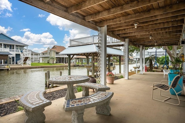 1220 Waterways Dr, Crystal Beach, TX 77650 - view of patio / terrace with a water view, a residential view, and a dock
