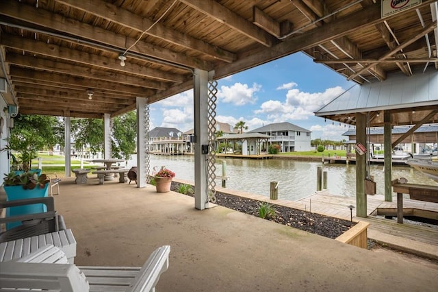 1220 Waterways Dr, Crystal Beach, TX 77650 - view of patio featuring a water view and a boat dock
