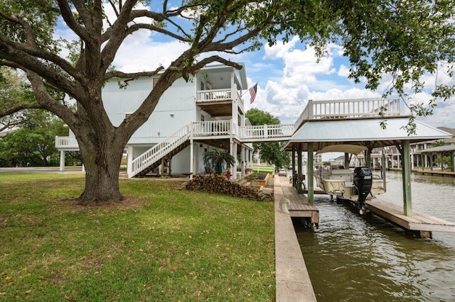 1220 Waterways Dr, Crystal Beach, TX 77650 - dock area featuring stairs, boat lift, a water view, and a yard