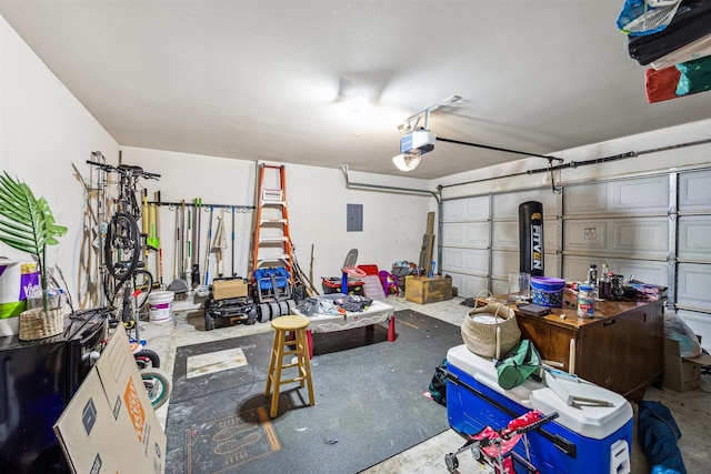 garage with electric panel and a garage door opener