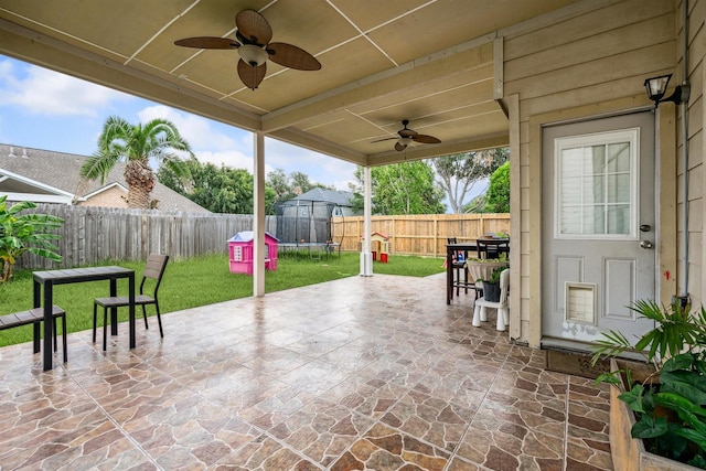 view of patio / terrace with ceiling fan and a trampoline