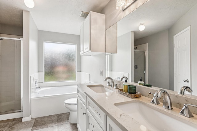 full bathroom featuring shower with separate bathtub, a textured ceiling, and toilet