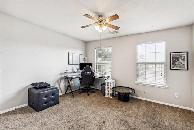 office space featuring ceiling fan and carpet floors