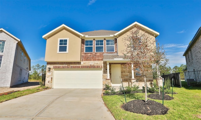 view of front of home featuring a front yard and a garage