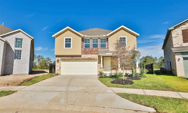 view of front of property with a front yard and a garage