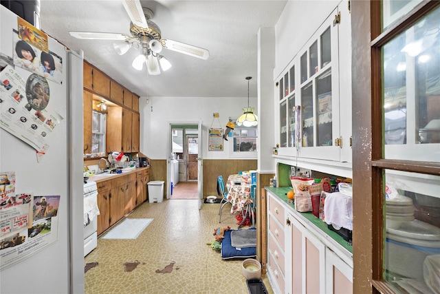 kitchen featuring white cabinetry, white appliances, decorative light fixtures, and ceiling fan