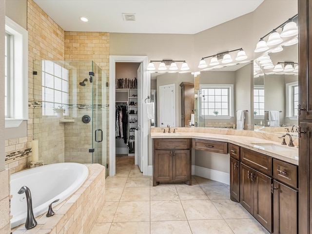 full bath featuring double vanity, a stall shower, visible vents, a sink, and a bath