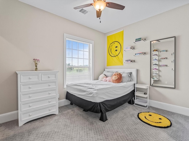 bedroom featuring a ceiling fan, carpet, visible vents, and baseboards