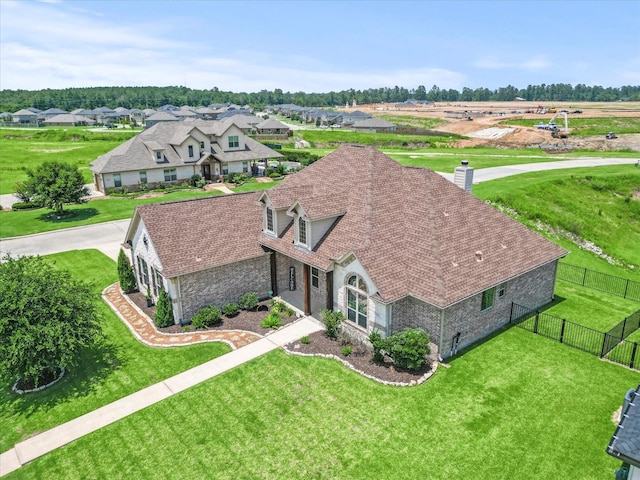 birds eye view of property with a residential view