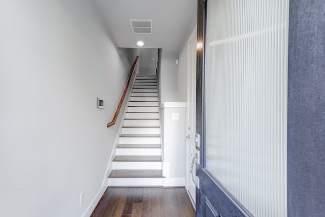 stairway featuring dark hardwood / wood-style flooring