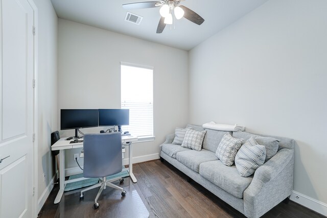 office with dark hardwood / wood-style flooring and ceiling fan