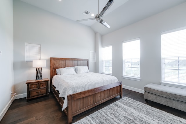 bedroom featuring dark hardwood / wood-style floors, ceiling fan, and lofted ceiling