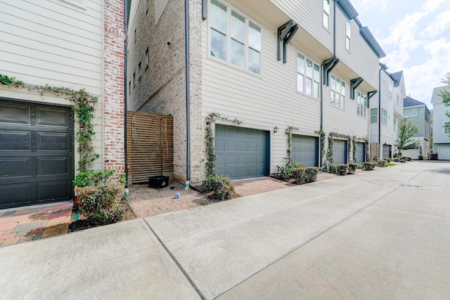 view of side of home with a garage