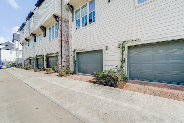 view of property exterior with a garage