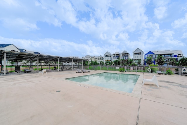 view of swimming pool with a patio area