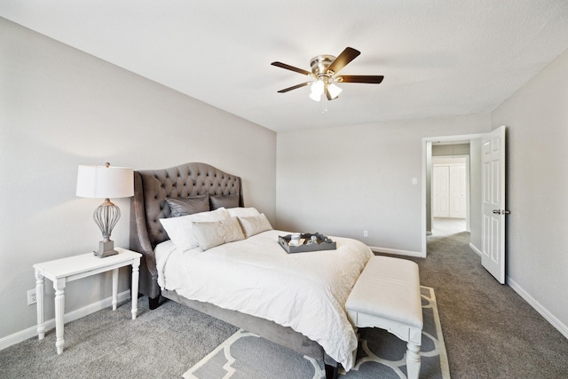 bedroom with dark colored carpet and ceiling fan