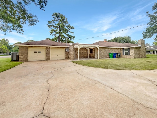 ranch-style house with a garage and a front yard