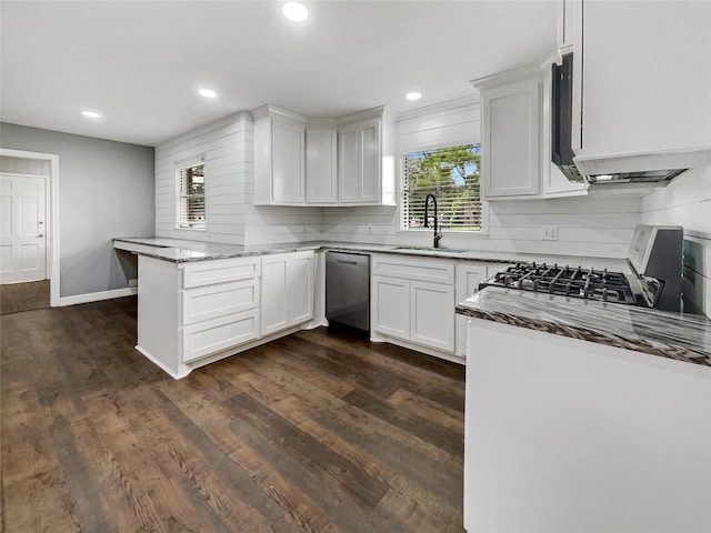 kitchen featuring white cabinets, sink, kitchen peninsula, light stone counters, and stainless steel dishwasher