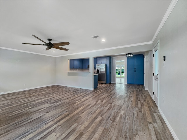 unfurnished living room with ceiling fan, ornamental molding, and hardwood / wood-style flooring