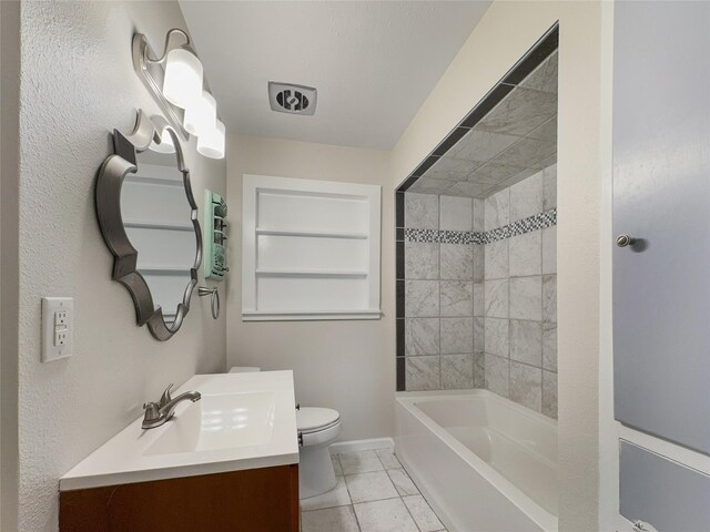 full bathroom with tiled shower / bath, vanity, toilet, and tile floors