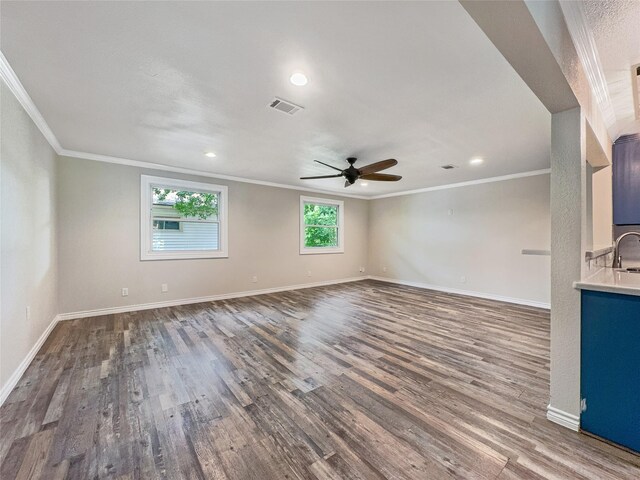 unfurnished living room with wood-type flooring, ceiling fan, and crown molding