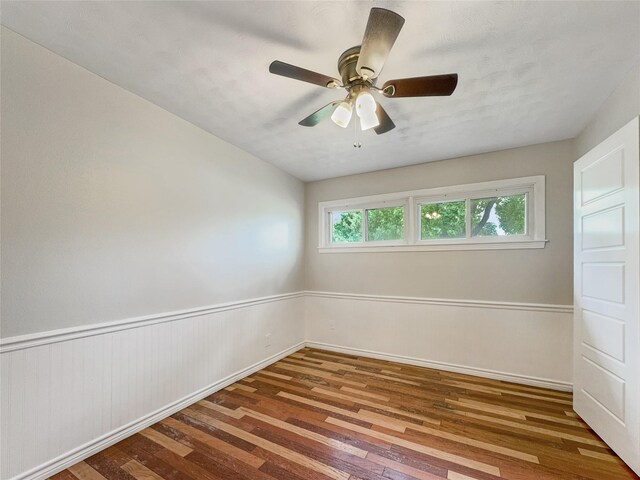 unfurnished room with wood-type flooring and ceiling fan