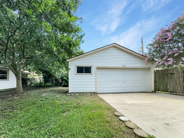 garage featuring a yard