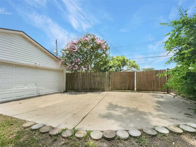 view of patio / terrace featuring a garage