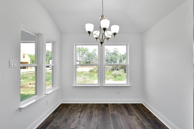 unfurnished dining area featuring vaulted ceiling, an inviting chandelier, and dark wood-type flooring