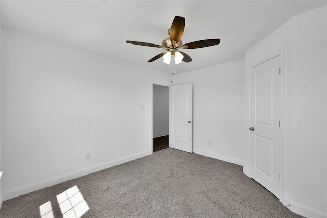 unfurnished bedroom featuring carpet flooring and ceiling fan