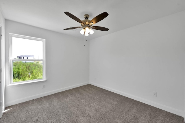 unfurnished room featuring carpet flooring and ceiling fan