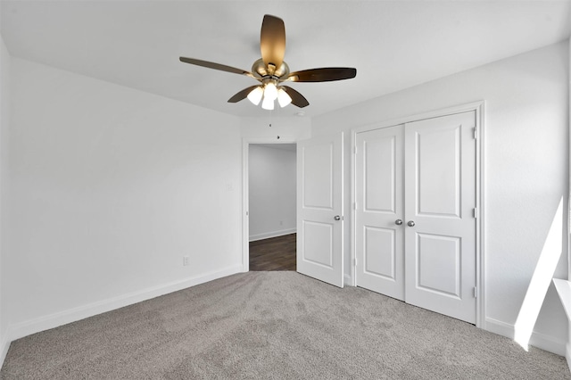 unfurnished bedroom with carpet flooring, a closet, and ceiling fan