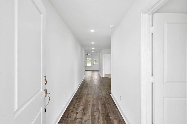 hallway with dark hardwood / wood-style flooring