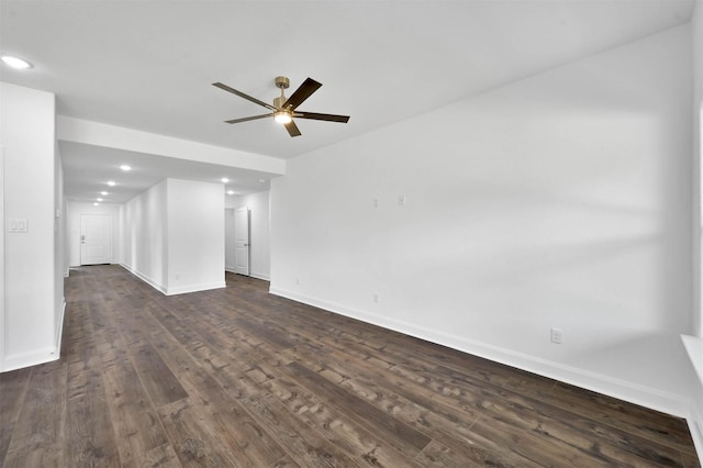 spare room featuring ceiling fan and dark hardwood / wood-style floors