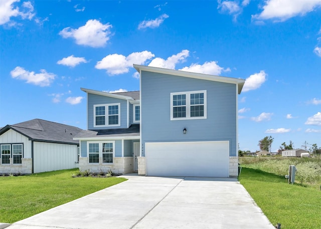 view of front of house with a garage and a front lawn