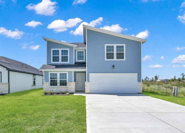 view of front of house featuring a garage and a front lawn