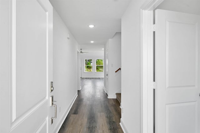 hallway with dark hardwood / wood-style flooring