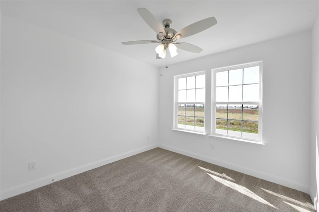 spare room featuring carpet flooring and ceiling fan