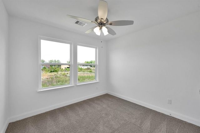 unfurnished room with carpet and ceiling fan