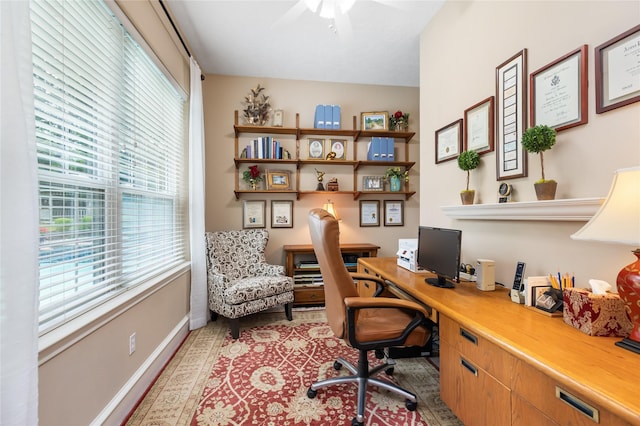 home office featuring ceiling fan and a healthy amount of sunlight