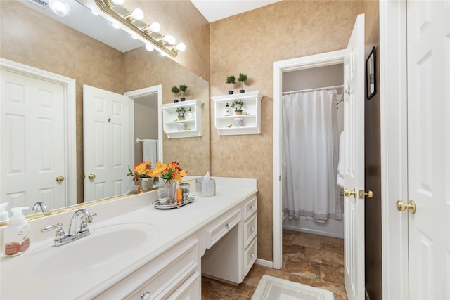 bathroom featuring vanity and walk in shower