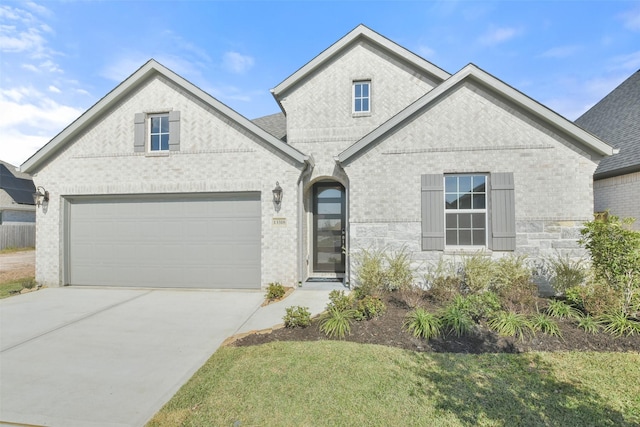 view of front facade with a front lawn and a garage