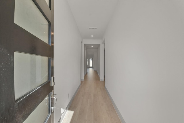 13318 Pine Lake Bnd, Tomball, TX 77375 - corridor featuring light wood-type flooring