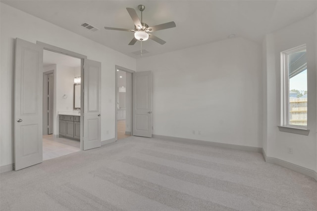 13318 Pine Lake Bnd, Tomball, TX 77375 - unfurnished bedroom featuring ceiling fan, light carpet, and connected bathroom