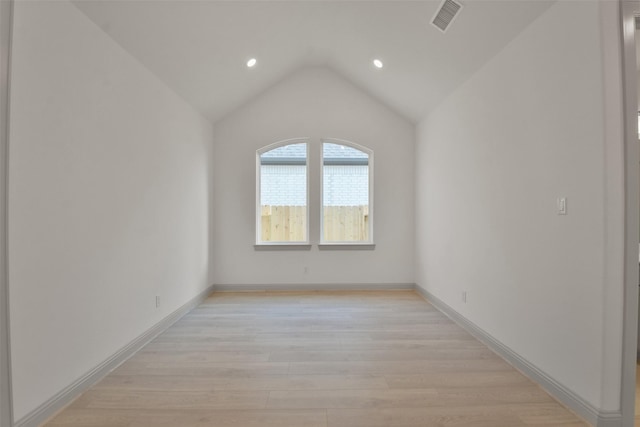 13318 Pine Lake Bnd, Tomball, TX 77375 - unfurnished room featuring light wood-type flooring and lofted ceiling