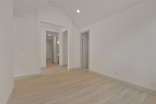 13318 Pine Lake Bnd, Tomball, TX 77375 - spare room with lofted ceiling and light wood-type flooring