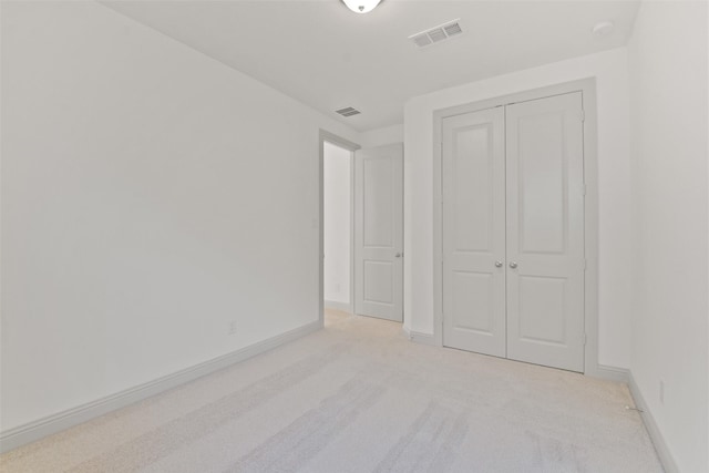 13318 Pine Lake Bnd, Tomball, TX 77375 - unfurnished bedroom with light colored carpet and a closet