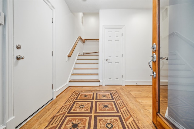 entrance foyer featuring wood-type flooring