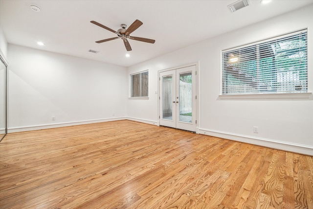 unfurnished room featuring light hardwood / wood-style flooring, french doors, and ceiling fan