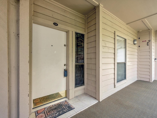 entrance to property with covered porch